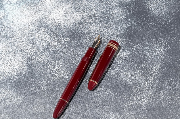 Fountain pen on a marble and gray background Selective focus