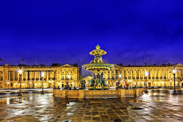 Fountain at Place de la Concord in Paris  by dusk. France.