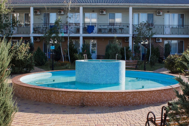 Fountain with blue water near the building