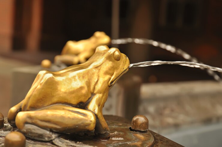 Photo fountain with golden lucky frog  - the symbol of  torun city