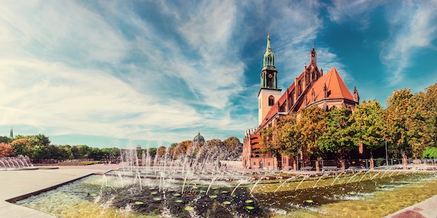 Fountains on Alexanderplatz and St. Mary's Church in Berlin