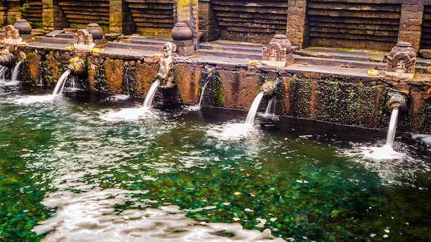 Fountains of holy waters in Pura Tirta Empul temple in Bali