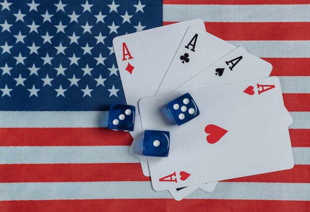 Photo four aces and dice on the of the usa flag.