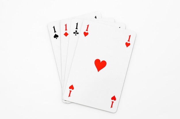 Four aces on white isolated