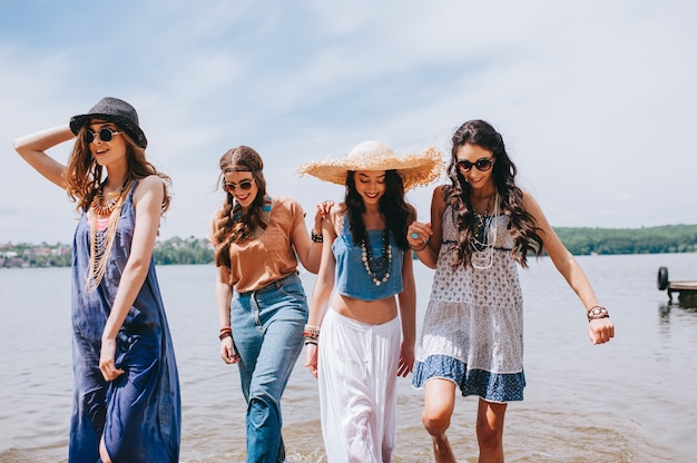 four beautiful girl friends on the dock