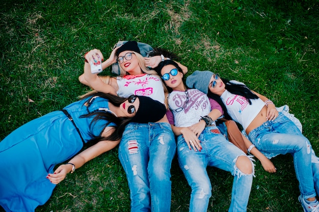 Four beautiful girls on the grass