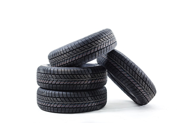 four black tires isolated on white background