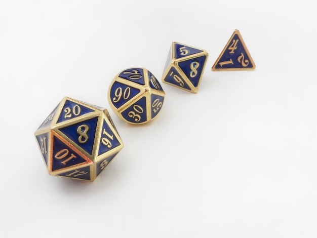 Four blue and gold dice isolated on white and copy text