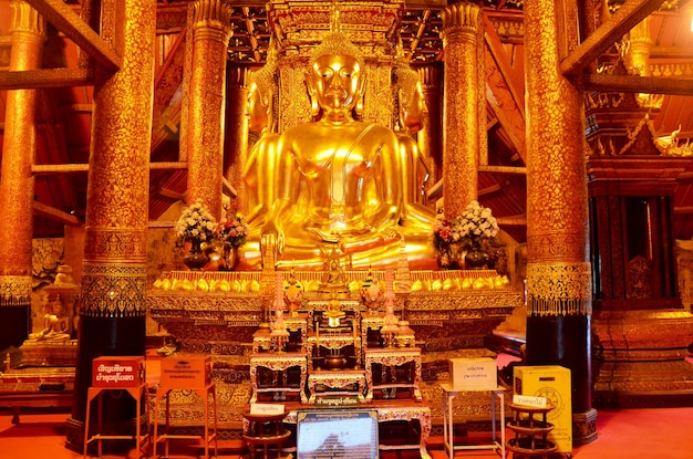 Photo four buddha statue image in ubosot or church of wat phu mintr or phumin temple is ancient temple for people visit and pray on july 26 2016 in nan thailand