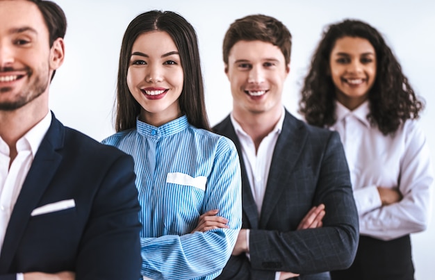 the four business people standing on the white background