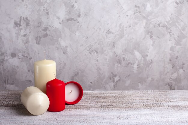 Four candles on a wooden table