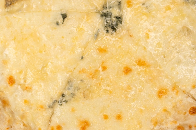 Four cheese pizza as a background