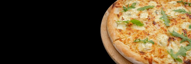 Four cheese pizza quattro fromaggi with arugula leaves on a black background Top view banner isolated on black