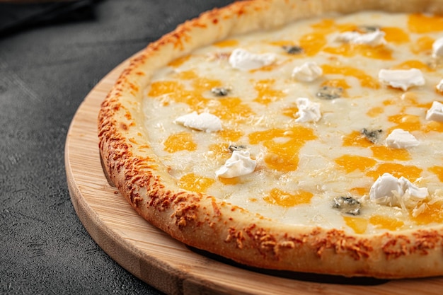 Four cheese pizza with cheddar and gorgonzola