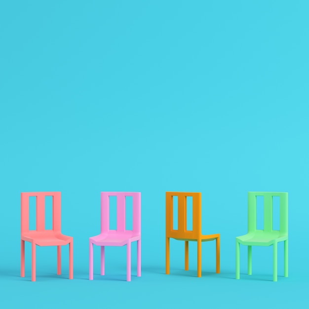 Four colorful chairs in pastel colors