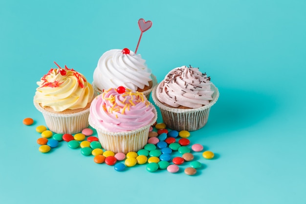 Four colorful cupcakes