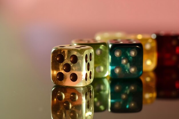 Photo four dice with a green one that says xmas on the bottom.