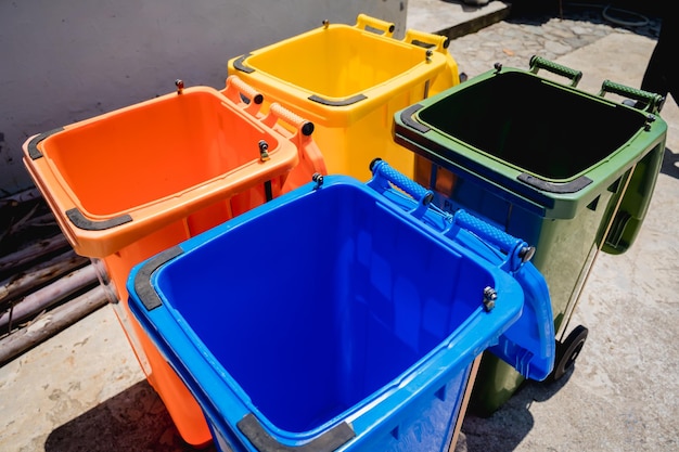 The four different container for sorting plastic paper metal and glass waste