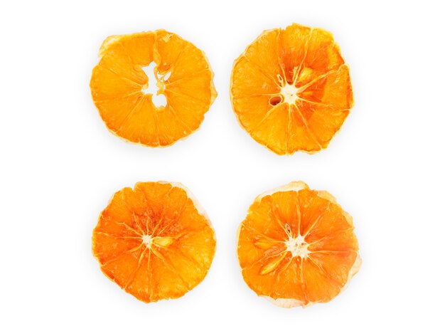 Four dried slices of orange isolated on white background