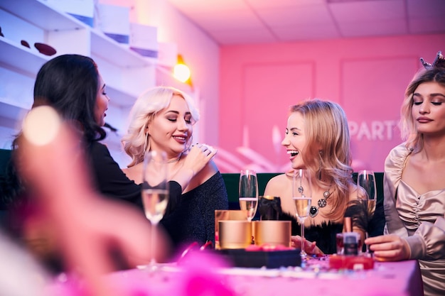 Four female colleagues having an office party