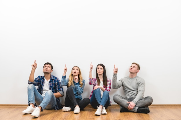 The four friends gesture on the white background