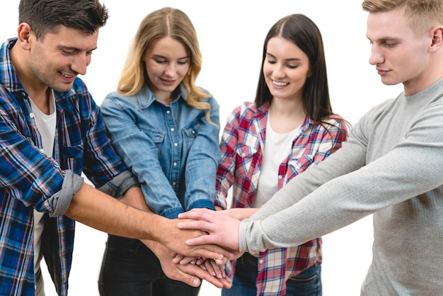 The four friends hold hands on the white background