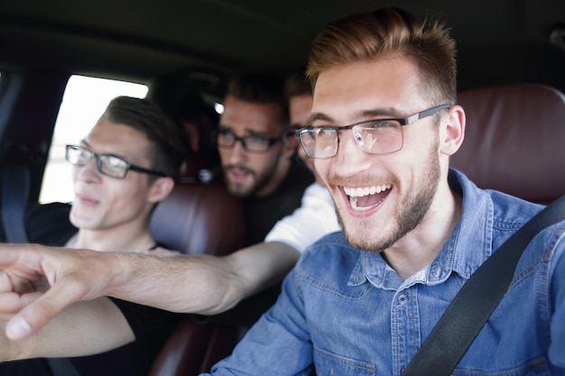 Four friends traveling in the car