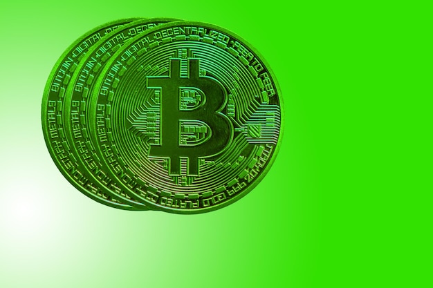 Four green bitcoin from crypto currency during rising market on green background