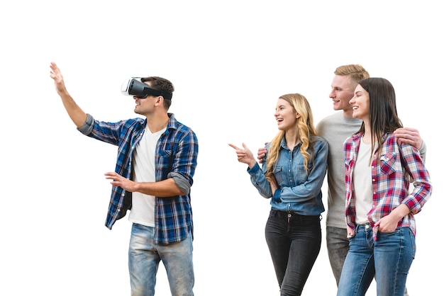 The four happy friends play with virtual reality glasses on a white background