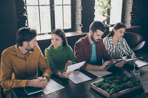 Four people smart emotions chief managers sit table desk have job applicant