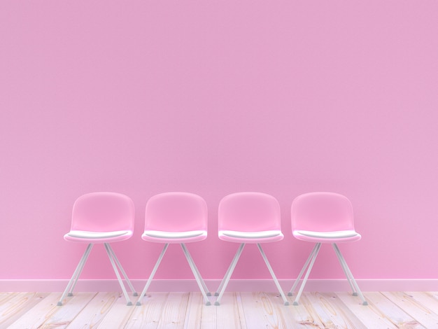 コンクリートの壁に4つのピンクの椅子