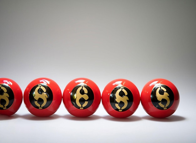 Photo four red balls with a gold dollar symbol on them.