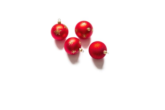 Four red christmas balls isolated on white background