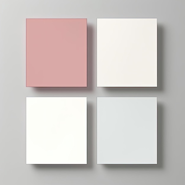 Four square pieces of paper on a gray background