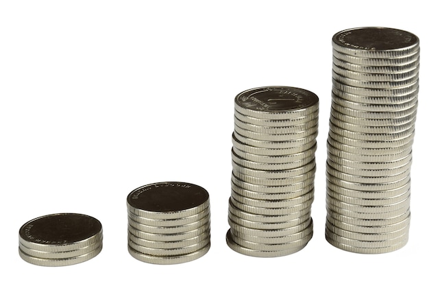 Four stacks of different sizes of iron silver coins on a white background