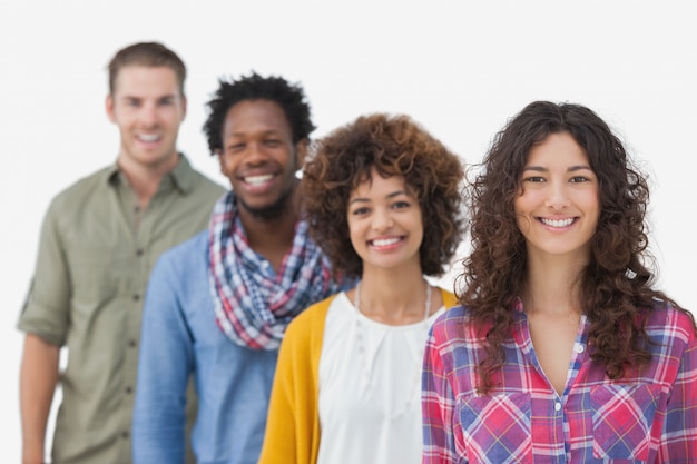 Four stylish friends standing in a line