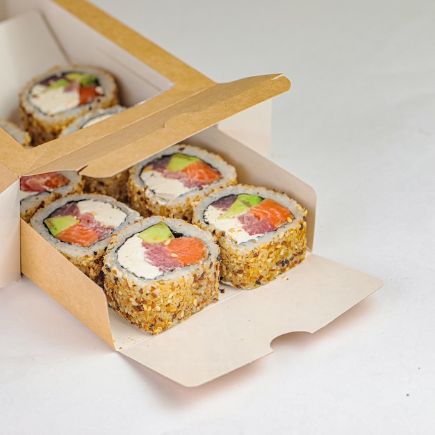 Four Sushi Rolls in Cardboard Box