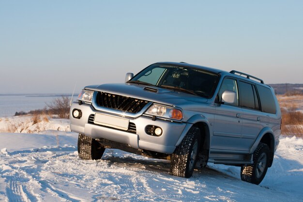 Four Wheel Drive Vehicle On Snowy Hill