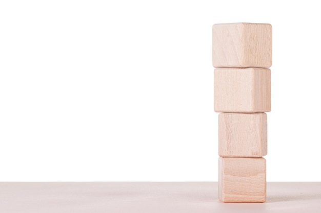 Four wooden cubes on a white background