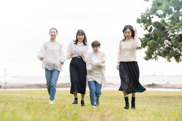 Four young japanese women running slowly in relax mood