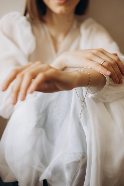 Fragile hands of a young woman in a photo with a shallow depth of field tenderness and lightness femininity and aesthetics in a photo of women's hands