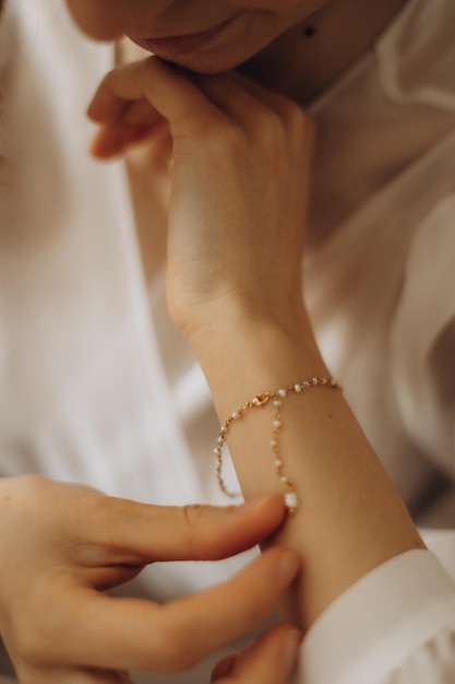 Fragile hands of a young woman in a photo with a shallow depth of field tenderness and lightness femininity and aesthetics in a photo of women's hands