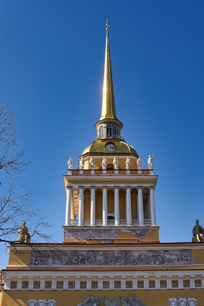 Fragment of the Admiralty tower in St. Petersburg against the blue sky. Historical sights of St. Petersburg