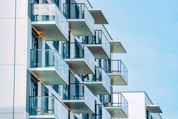 Fragment of Apartment house residential building complex real estate concept. Place for copy space. With blue sky