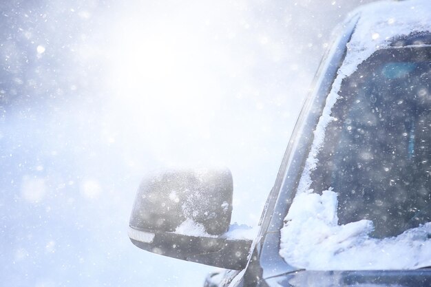 Fragment of a car in winter in hoarfrost background december city