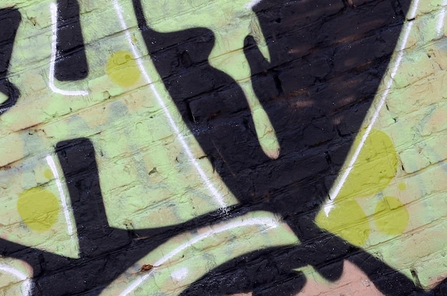 Fragment of colored street art graffiti paintings with contours and shading close up