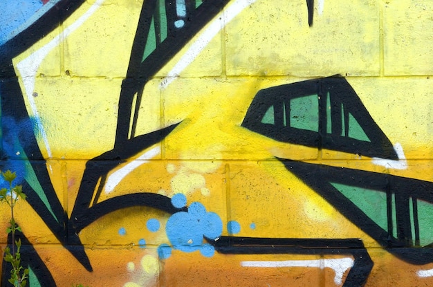 Photo fragment of colored street art graffiti paintings with contours and shading close up