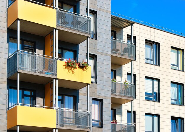 Fragment of complex of new apartment buildings with balconies.