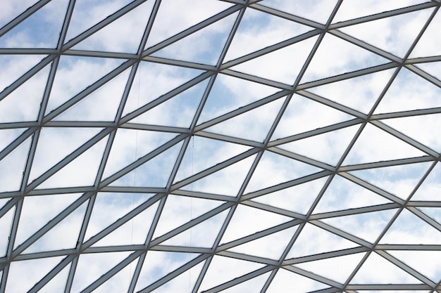 A fragment of a glass dome on the roof of the building Geometric glass dome