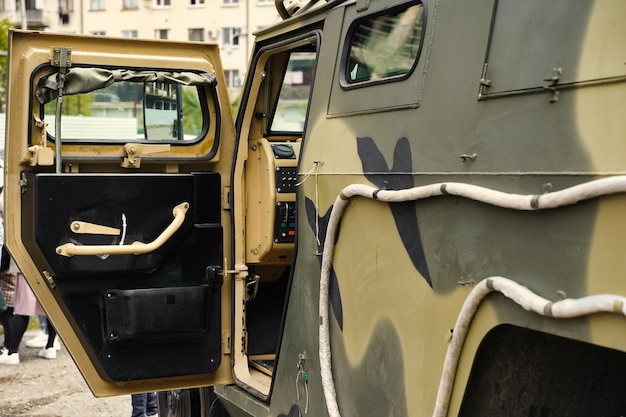 Fragment of a green military truck modern technologies of
military transport equipment